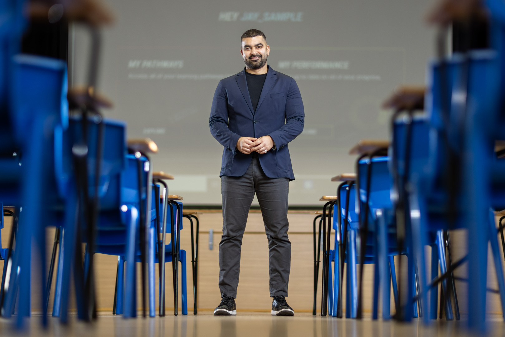 Tej Samani speaking to pupils in a classroom.