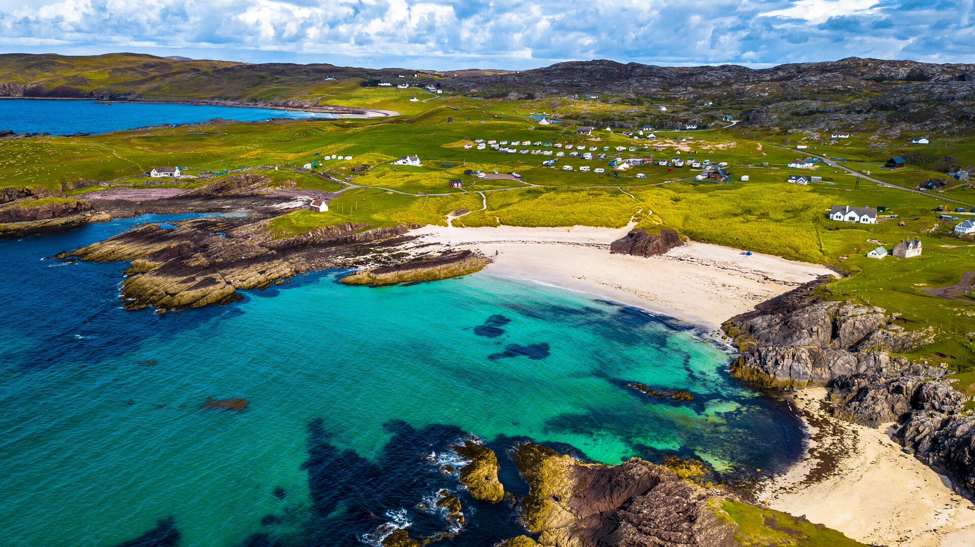 Aerial view of Clachtoll Beach campsite in Scotland.