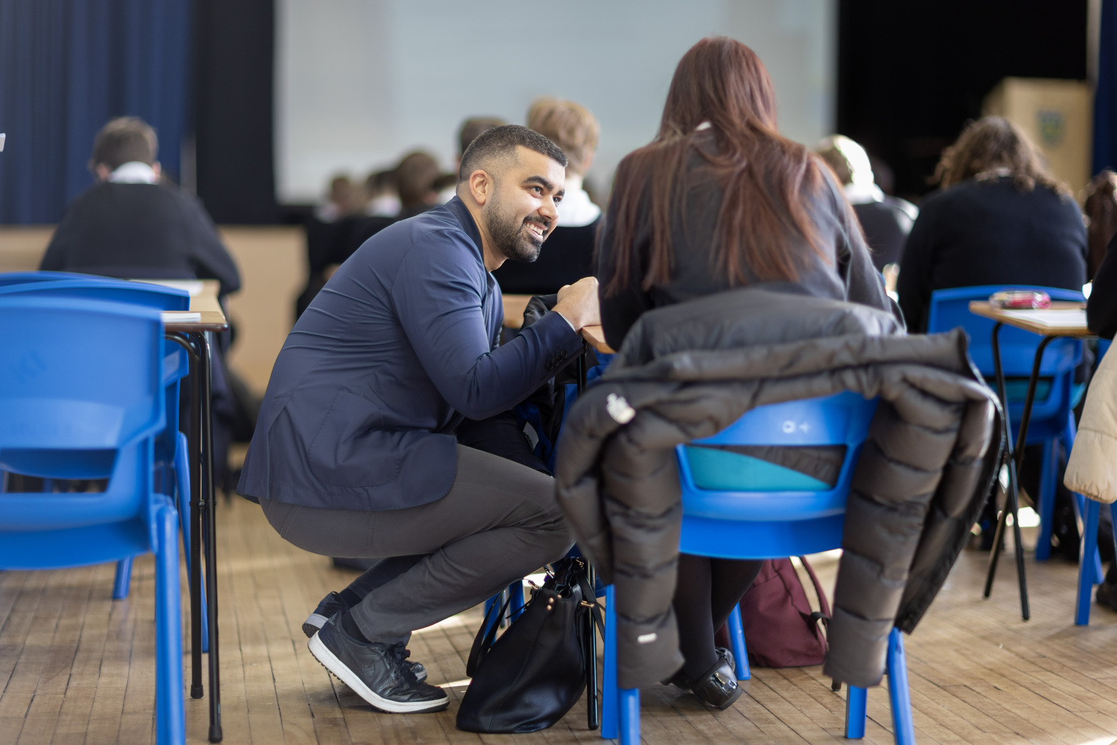 Tej Samani speaking to students in a classroom.